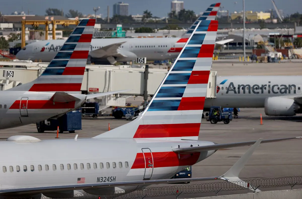 American Airlines planes parked at their gates in the Miami International Airport in Miami, Fla., on Dec. 10, 2021. (Joe Raedle/Getty Images)