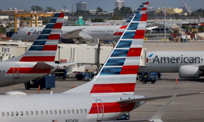 American Airlines planes parked at their gates in the Miami International Airport  in Miami, Fla., on Dec. 10, 2021. (Joe Raedle/Getty Images)