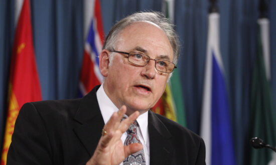 Charter’s Last Surviving Signatory and Former Premier Sues Ottawa Over Travel Vaccine Mandates