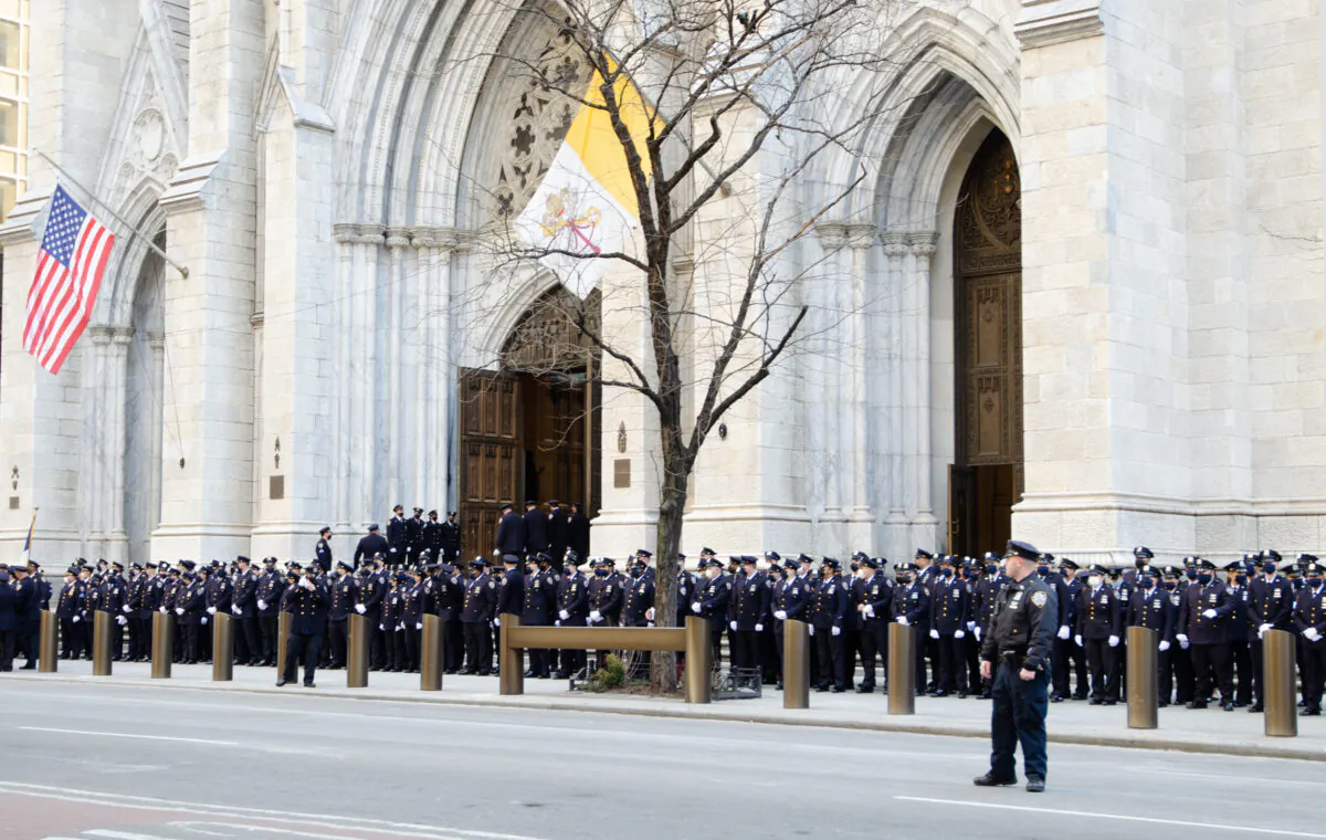 NYPD officers assemble at St. Patrick’s Cathedral in NYC for the wake of fallen PO Jason Rivera on Jan. 27, 2022. (Dave Paone/The Epoch Times)
