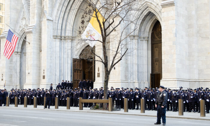 NYPD officers assemble at St. Patrick’s Cathedral in NYC for the wake of fallen policeman Jason Rivera on Jan. 27, 2022. (Dave Paone/The Epoch Times)