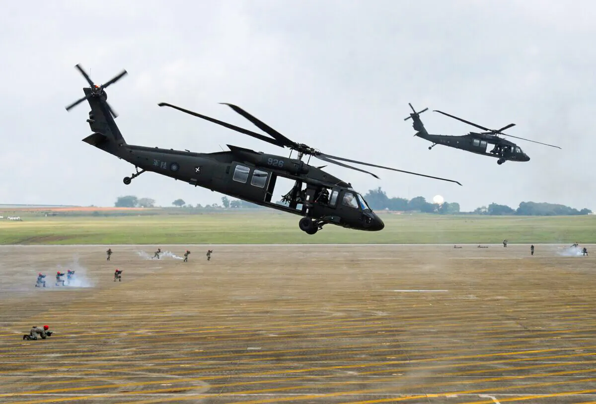 A pair of UH-60 Black Hawk helicopters take part in the Han Kuang drill at the Ching Chuan Kang (CCK) air force base in Taichung, central Taiwan, on June 7, 2018. (Sam Yeh/AFP via Getty Images)