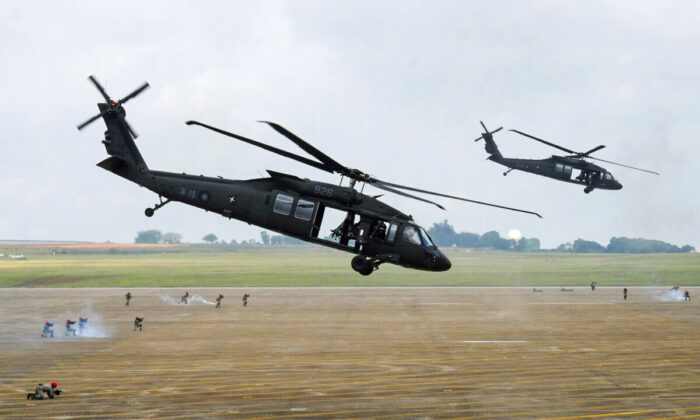 A pair of UH-60 Black Hawk helicopters take part in the Han Kuang drill at the Ching Chuan Kang (CCK) air force base in Taichung, central Taiwan, on June 7, 2018. (Sam Yeh/AFP via Getty Images)