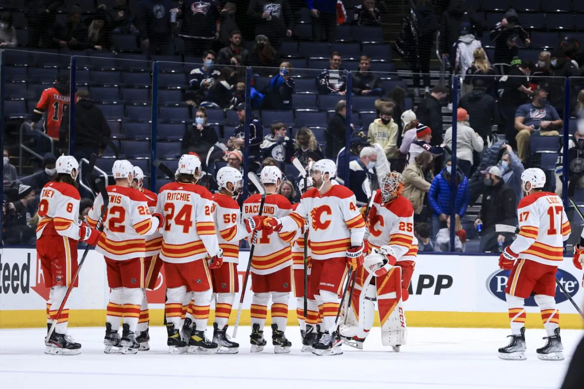 Calgary Flames goaltender Jacob Markstrom (25) celebrates with teammates after shutting out the Columbus Blue Jackets at Nationwide Arena, in Columbus, Ohio, on Jan. 26, 2022. (Aaron Doster/USA TODAY Sports via Field Level Media)
