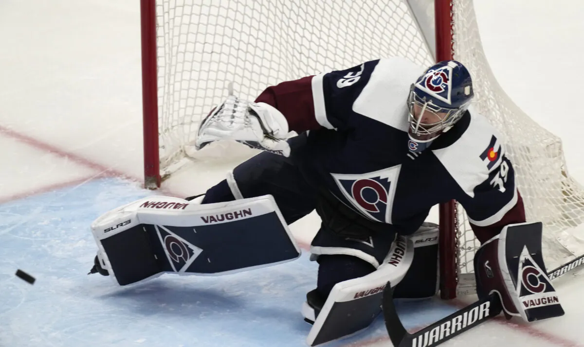 Colorado Avalanche goaltender Pavel Francouz makes a skate save of a shot against the Chicago Blackhawks in the third period of an NHL hockey game in Denver on Jan. 24, 2022. (David Zalubowski/AP Photo)