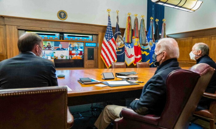 President Joe Biden holds a meeting with his national security team on the Russia-Ukraine crisis, at Camp David, Md., on Jan. 22, 2022. (The White House/Handout via Reuters)