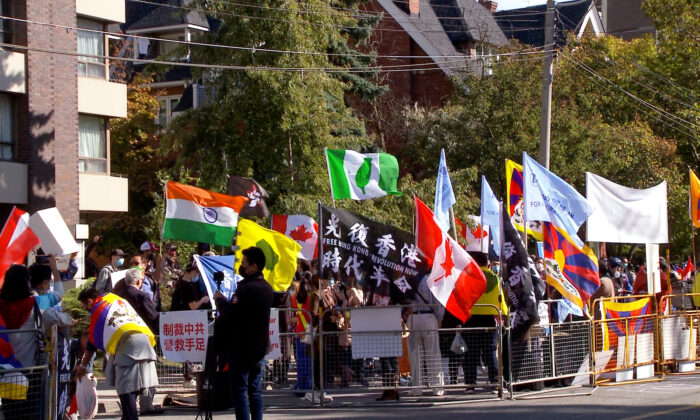 Tibetans, Uyghurs, Kazakhs, Hongkongers, Southern Mongolians, Taiwanese, and Chinese Democracy Activists join together for the Global Day of Action to call on governments to stand against the Chinese Communist Party’s suppression of freedom, democracy, and human rights, in front of the Chinese Consulate in Toronto on Oct. 1, 2020. (NTD Television)