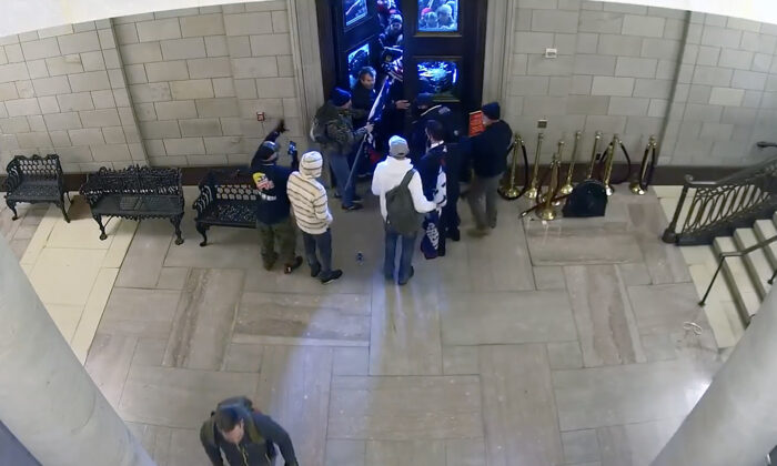 Video from a U.S. Capitol Police surveillance camera was recently released by the Department of Justice. It shows protesters streaming into the U.S. Capitol through the historic Columbus Doors on Jan. 6, 2021. (Video Still/U.S. Department of Justice)