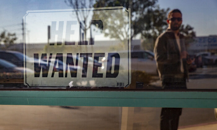 A help wanted sign is displayed in Fountain Valley, Calif., on Jan. 27, 2022. (John Fredricks/The Epoch Times)