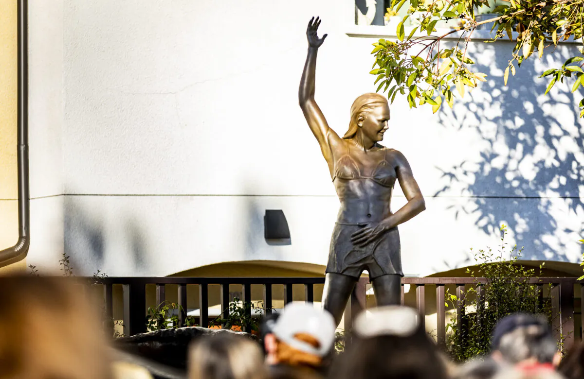 The unveiling of a statue depicting surfing icon Joyce Hoffman is held at Watermen's Plaza in Dana Point, Calif., on Jan. 27, 2022. (John Fredricks/The Epoch Times)