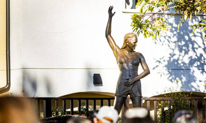 The unveiling of a statue depicting surfing icon Joyce Hoffman is held at Watermen's Plaza in Dana Point, Calif., on Jan. 27, 2022. (John Fredricks/The Epoch Times)