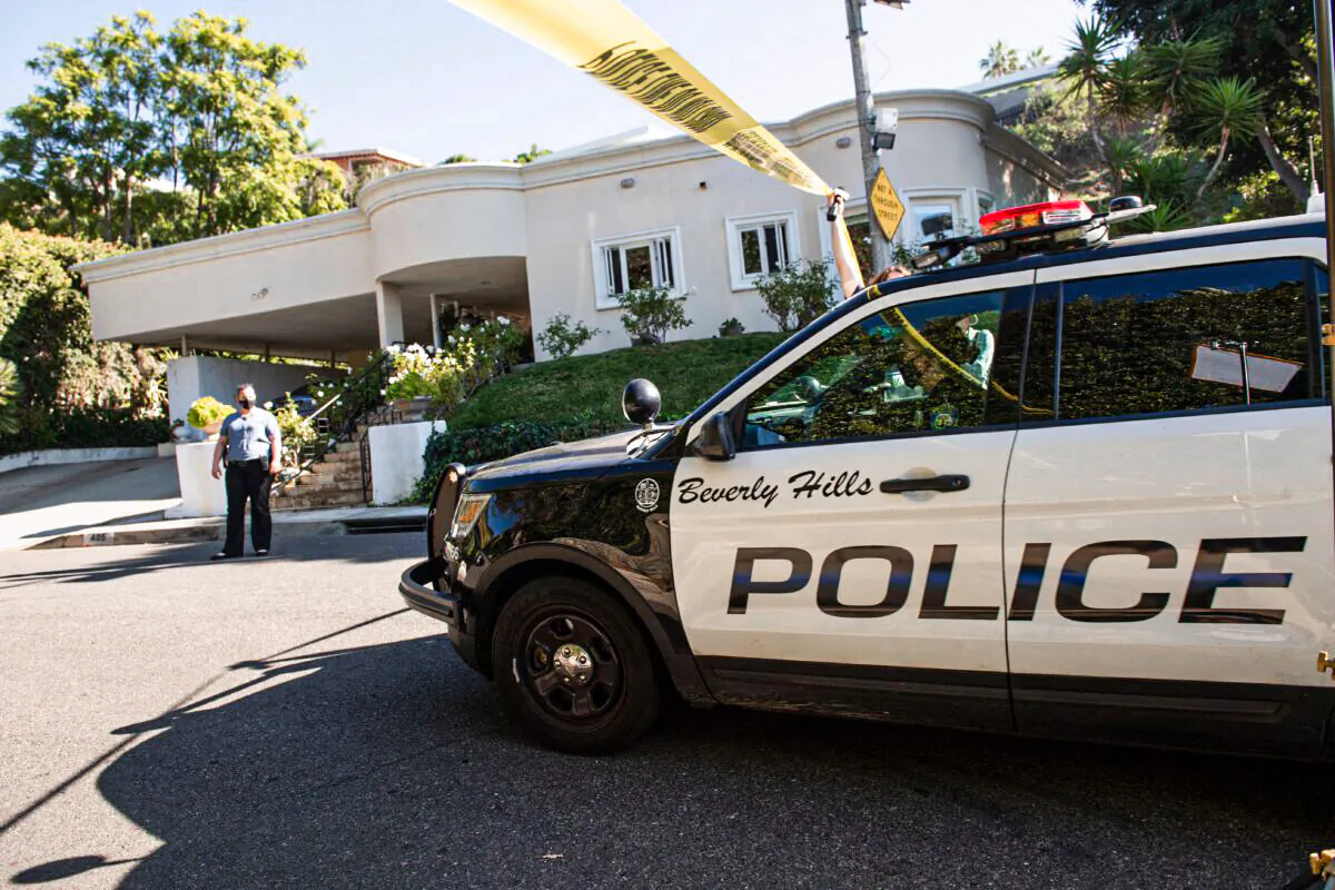Police tape blocks access to the scene of a burglary and shooting in Beverly Hills, Calif., on Dec. 1, 2021. (Valerie Macon/AFP via Getty Images)