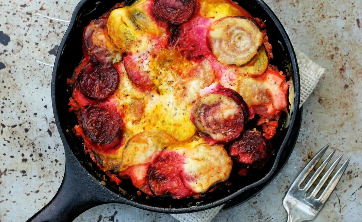 If you must cloak a vegetable, this is the way to do it: with creamy layers of garlic, orange-infused sour cream, and Gruyere cheese. (Lynda Balslev for Tastefood)