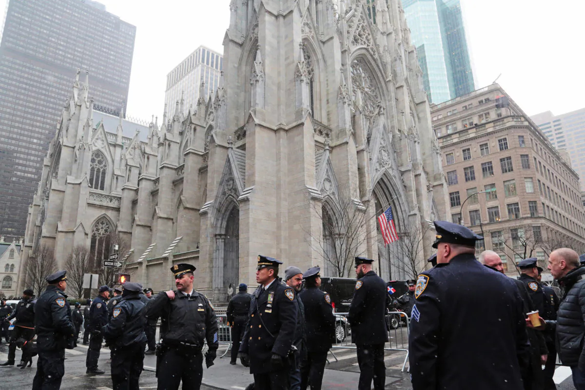 Fellow police officers turned out in the thousands during the funeral of Jason Rivera at St Patrick's Cathedral in New York on Jan. 28, 2022. (Richard Moore/The Epoch Times)