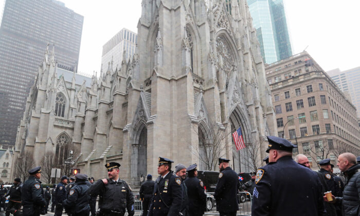 Fellow police officers turned out in the thousands during the funeral of Jason Rivera at St Patrick's Cathedral in New York on Jan. 28, 2022. (Richard Moore/The Epoch Times)