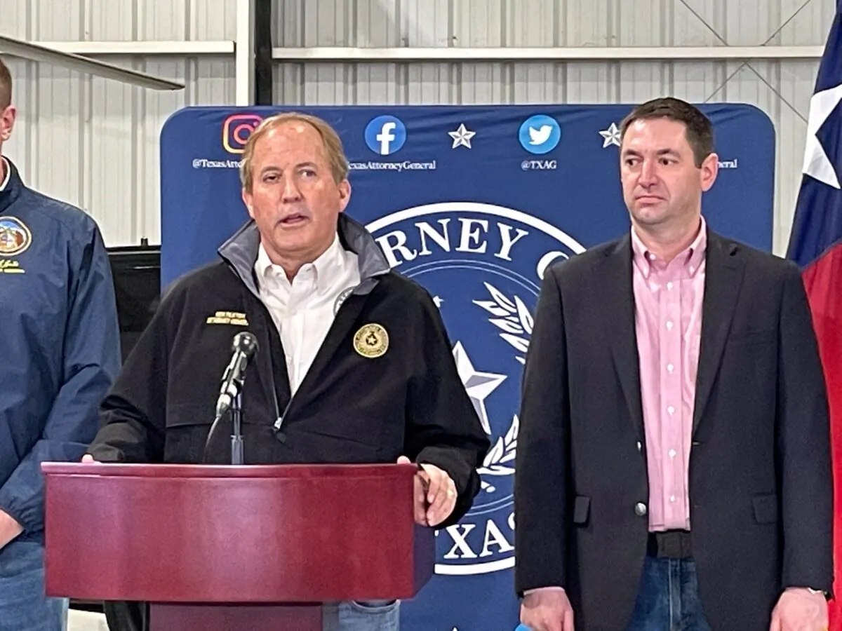 Tex Attorney General Ken Paxton (C) and Montana Attorney General Austin Knudsen announce a lawsuit against President Joe Biden's administration, in Edinburgh, Texas, on Jan. 28, 2022. (Charlotte Cuthbertson/The Epoch Times)