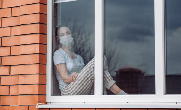 Home,Quarantine.,Caucasian,Woman,Sitting,At,Window,In,A,Medical