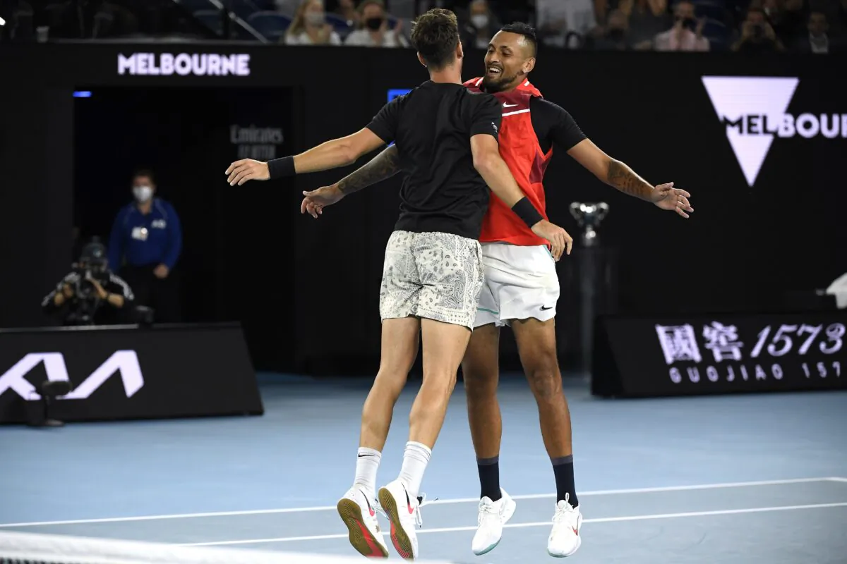Nick Kyrgios, (R), and Thanasi Kokkinakis of Australia celebrate after defeating compatriots Matthew Ebden and Max Purcell in the men's doubles final at the Australian Open tennis championships  in Melbourne, Australia. on Jan. 29, 2022. (Andy Brownbill/AP Photo)