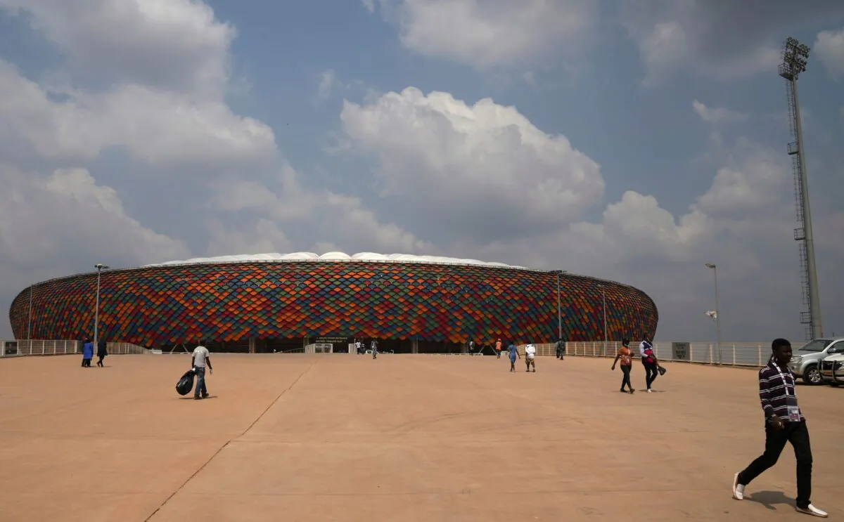 People walking at a newly built Olembe stadium in Yaounde, Cameroon, on Jan. 8, 2022. (Themba Hadebe/AP Photo)