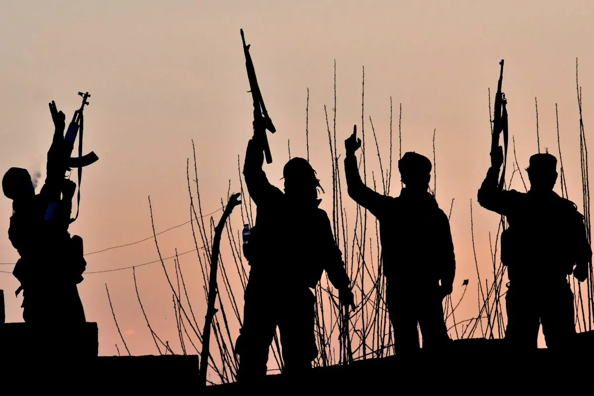 A file image of U.S.-backed Syrian Democratic Forces fighters celebrating after fighting Islamic State jihadists near the village of Baghouz in the eastern Syrian province of Deir Ezzor, on March 15, 2019. (Giuseppe Cacace/AFP)
