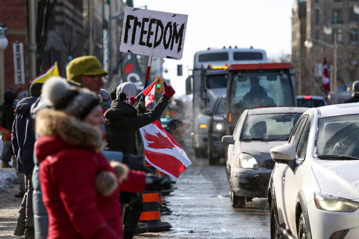 Supporters of the Freedom Convoy protest against COVID-19 vaccine mandates and restrictions in front of Parliament of Canada, in Ottawa, Canada, on Jan. 28, 2022. (Dave Chan/AFP via Getty Images)