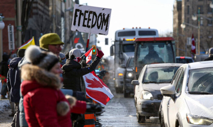 Supporters of the Freedom Convoy protest against COVID-19 vaccine mandates and restrictions in front of Parliament of Canada, in Ottawa, Canada, on Jan. 28, 2022. (Dave Chan/AFP via Getty Images)