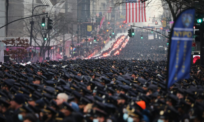 Thousands of police officers from around the country gather at St. Patrick's Cathedral to attend the funeral for fallen NYPD Officer Jason Rivera in New York City on Jan. 28, 2022. The 22-year-old NYPD officer was shot and killed on Jan. 21 in Harlem while responding to a domestic disturbance call. Rivera's partner, Officer Wilbert Mora, also died from injuries suffered in the shooting. (Spencer Platt/Getty Images)