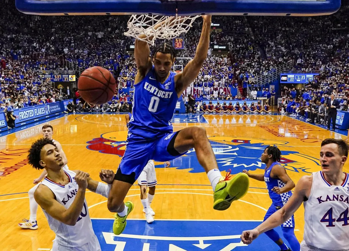 Kentucky Wildcats forward Jacob Toppin (0) dunks the ball against Kansas Jayhawks forward Jalen Wilson (10) and forward Mitch Lightfoot (44) during the first half at Allen Fieldhouse in Lawrence, Kan., on Jan. 29, 2022. (Jay Biggerstaff/USA TODAY Sports via Field Level Media)