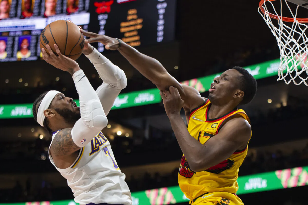 Atlanta Hawks forward Onyeka Okongwu (17) blocks Los Angeles Lakers forward Carmelo Anthony (7) during the second half of an NBA basketball game in Atlanta on Jan. 30, 2022. (Hakim Wright Sr./AP Photo)