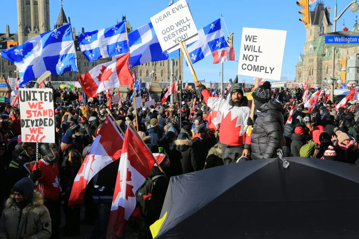 Thousands of protesters take part in a massive "Freedom Convoy" to protest the federal government's COVID-19 vaccine mandates and restrictions, in Ottawa on Jan. 29, 2022, (Jonathan Ren/The Epoch Times)