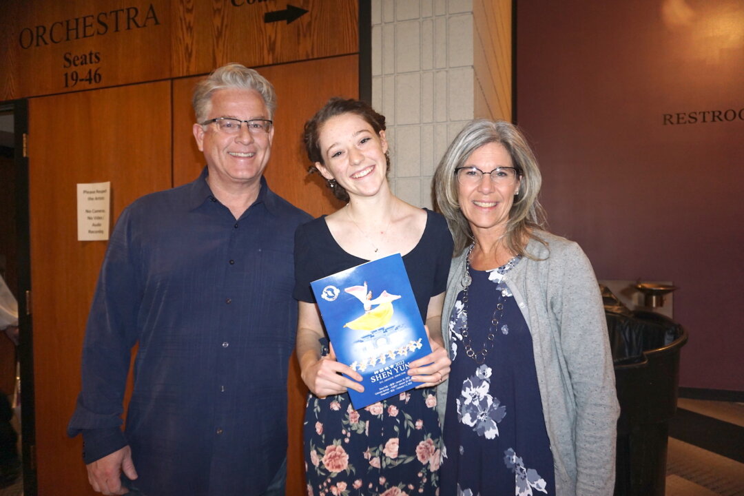 Bryan, Emma, and Jeanna Helgesen at the Shen Yun performance in Colorado Springs, on Jan. 30, 2022 .(Sally Sun/Epoch Times)