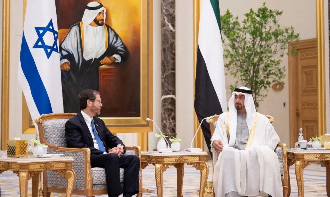 Israeli President Isaac Herzog meets with Abu Dhabi's Crown Prince Sheikh Mohammed bin Zayed al-Nahyan in Abu Dhabi, United Arab Emirates, on Jan. 30, 2022. (Mohamed Al Hammadi/Ministry of Presidential Affairs/WAM/Handout via Reuters)