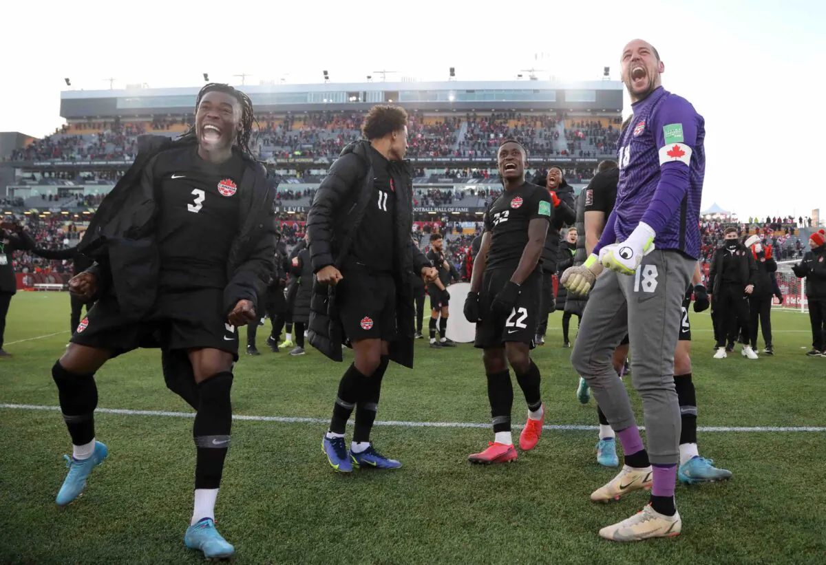 Soccer Football - World Cup - CONCACAF Qualifiers - Canada v United States - Tim Hortons Stadium, Hamilton, Canada - Jan. 30, 2022. Canada's Sam Adekugbe and Milan Borjan celebrate after the match (Reuters/Carlos Osorio)