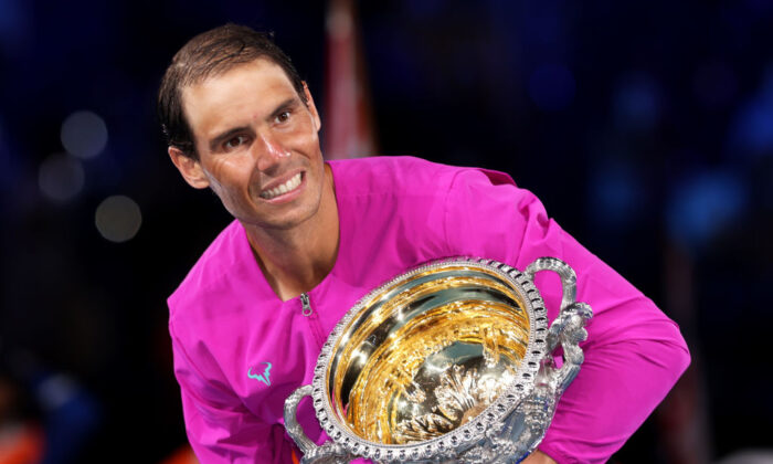 Rafael Nadal poses with the Norman Brookes Challenge Cup as he celebrates victory in his Men’s Singles Final match against Daniil Medvedev during day fourteen of the 2022 Australian Open at Melbourne Park in Melbourne, Australia on January 30, 2022 . (Photo by Clive Brunskill/Getty Images)