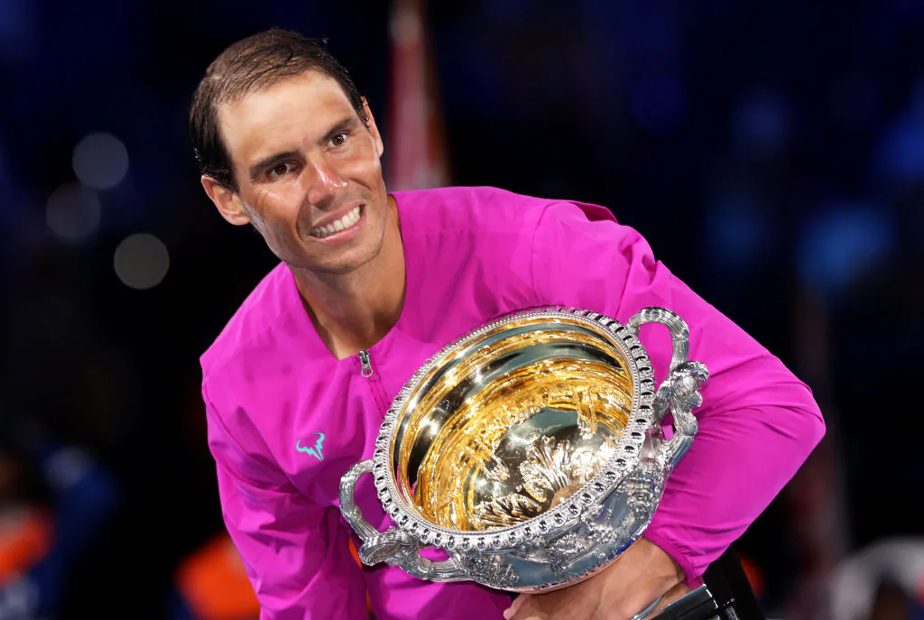 Rafael Nadal poses with the Norman Brookes Challenge Cup as he celebrates victory in his Men’s Singles Final match against Daniil Medvedev during day fourteen of the 2022 Australian Open at Melbourne Park in Melbourne, Australia on January 30, 2022 . (Photo by Clive Brunskill/Getty Images)