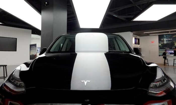 A Tesla Model Y electric vehicle is displayed on a showroom floor at the Miami Design District in Miami on Oct. 21, 2021. (Joe Raedle/Getty Images)