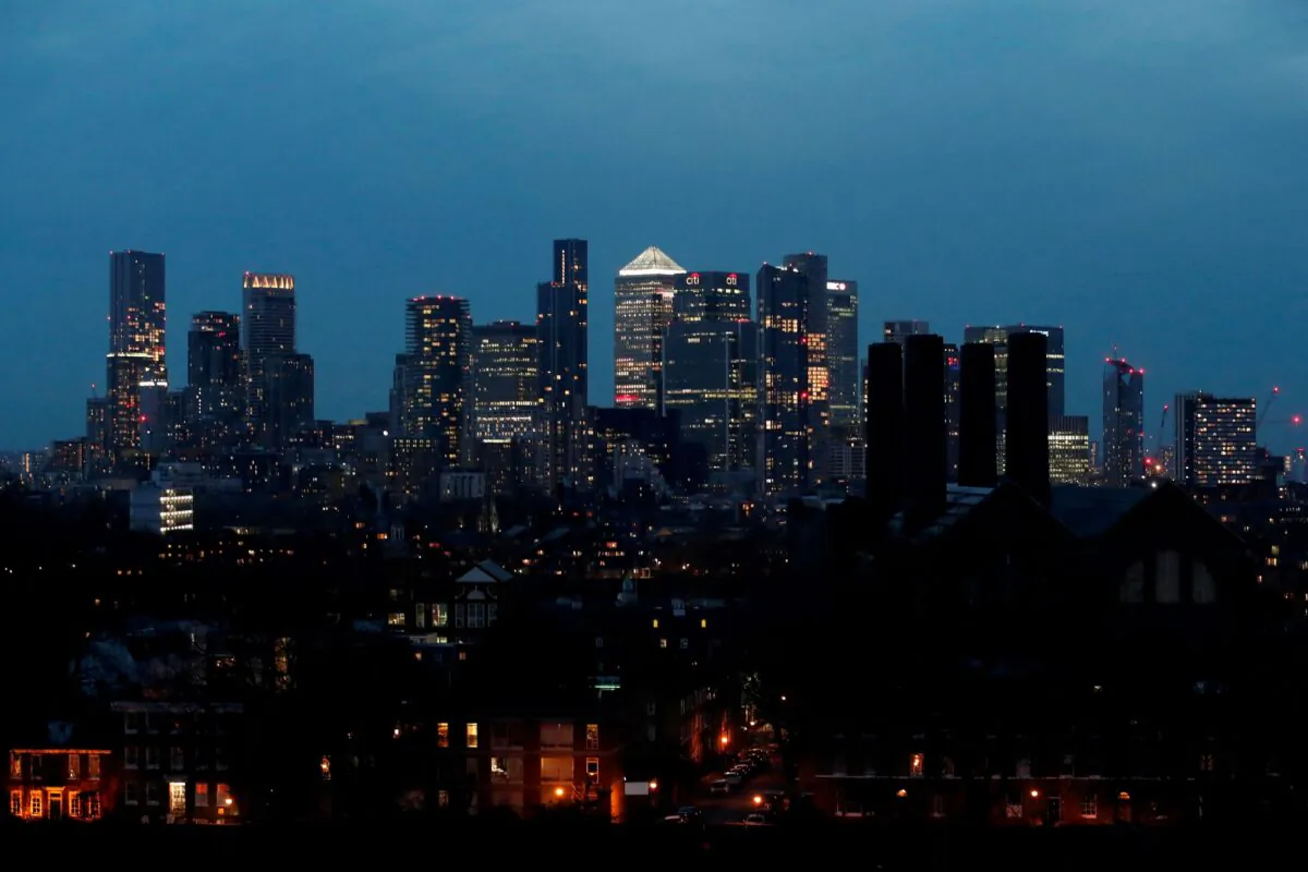 View of Canary Wharf business district at dusk in London, Britain, on March 9, 2021. (Peter Cziborra/Reuters)
