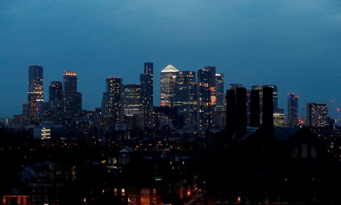 View of Canary Wharf business district at dusk in London, Britain, on March 9, 2021. (Peter Cziborra/Reuters)