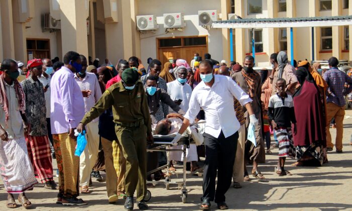 People injured in the blast arrive for treatment at the referral hospital in Mandera, in northeastern Kenya, on Jan. 31, 2022. (AP Photo)
