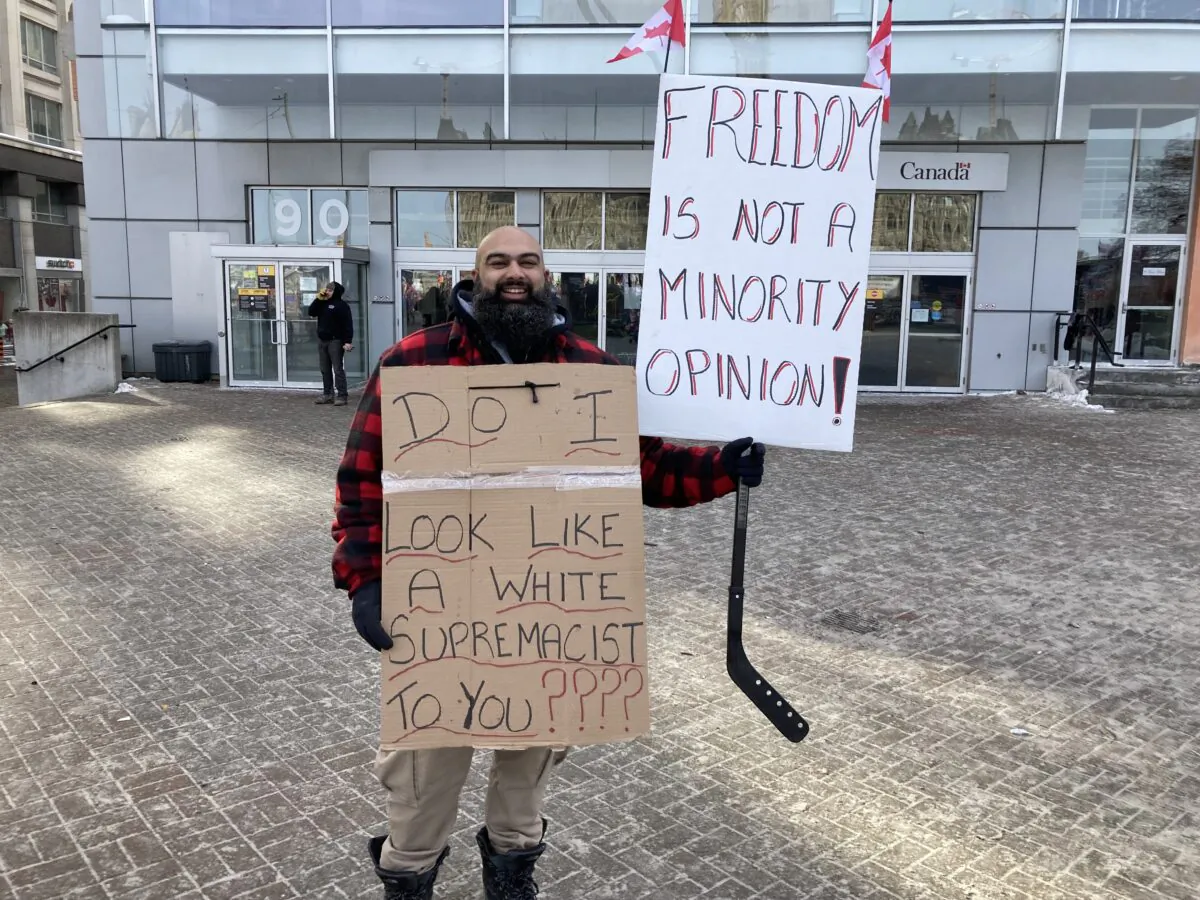 Bal Tiwana, shown in downtown Ottawa on Feb. 1, 2022, drove from Calgary to Ottawa with his wife and young son to attend the protests against COVID-19 vaccine mandates and other pandemic restrictions. (Rahul Vaidyanath/The Epoch Times)