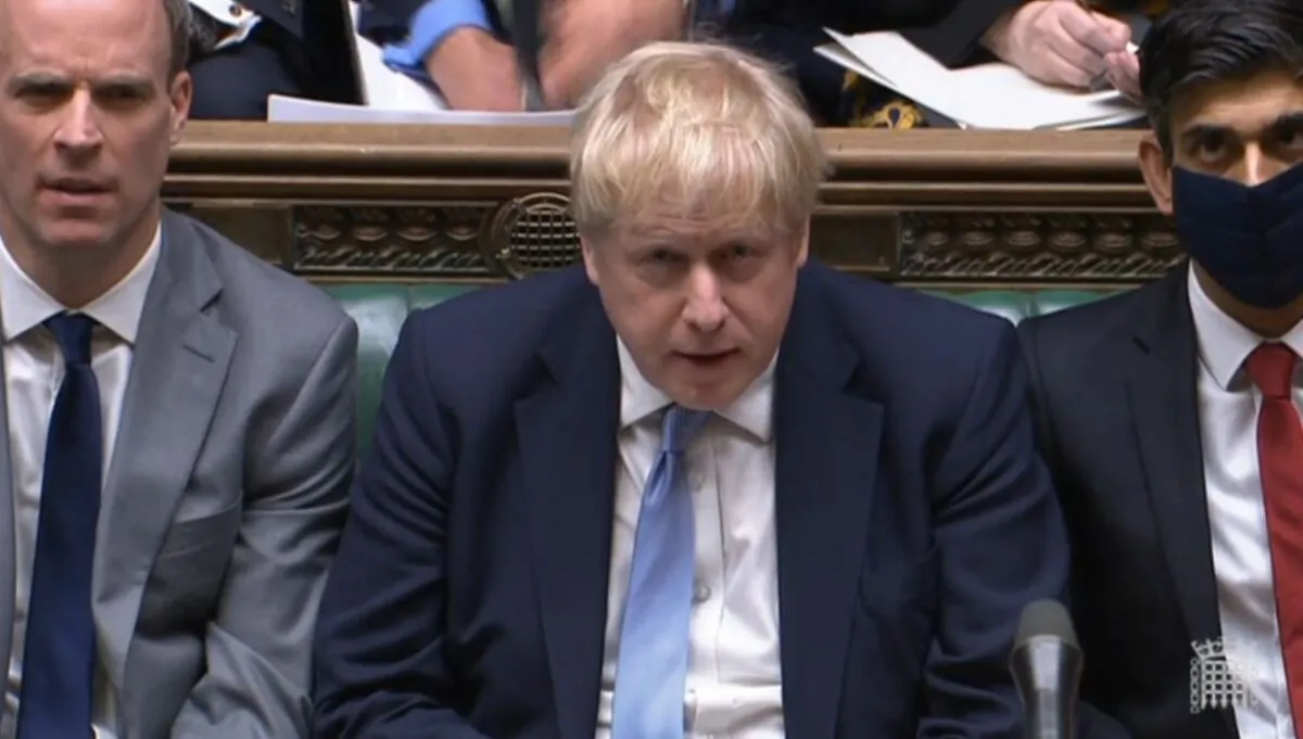 Prime Minister Boris Johnson listens as Labour leader Sir Keir Starmer responds to his statement to MPs in the House of Commons on the Sue Gray report, in London on Jan. 31, 2022. (PA)