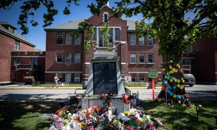 Flowers and cards left at a monument outside the former Kamloops Indian Residential School, in Kamloops, B.C., on May 31, 2021. (The Canadian Press/Darryl Dyck)