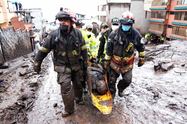 Rescue workers carry a victim