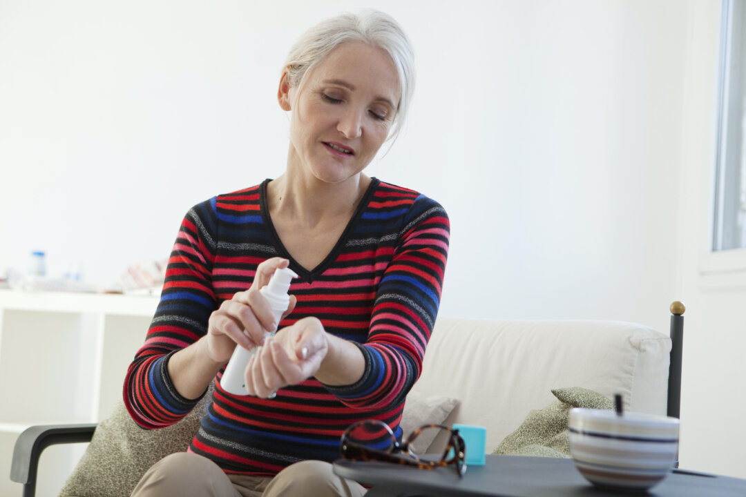 A woman taking hormone replacement therapy in a stock photo. (Image Point Fr/Shutterstock)