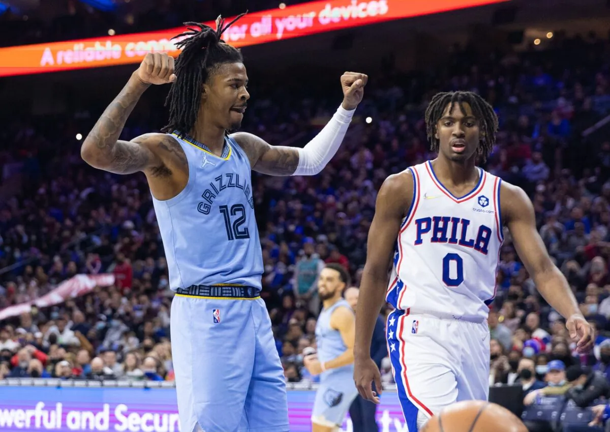 Memphis Grizzlies guard Ja Morant (12) reacts in front of Philadelphia 76ers guard Tyrese Maxey (0) after dunking the ball during the third quarter at Wells Fargo Center, in Philadelphia, on Jan. 31, 2022. (Bill Streicher/USA TODAY Sports via Field Level Media)