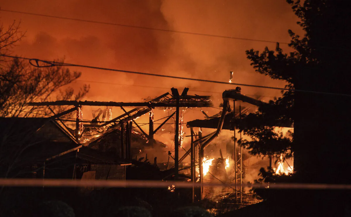 A structure fire burns at the Weaver Fertilizer Plant in Winston-Salem, N.C., on Jan. 31, 2022. (Allison Lee Isley/The Winston-Salem Journal via AP)
