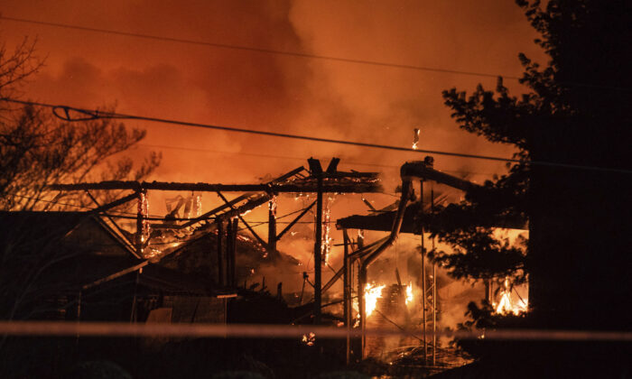 A structure fire burns at the Weaver Fertilizer Plant in Winston-Salem, N.C., on Jan. 31, 2022. (Allison Lee Isley/The Winston-Salem Journal via AP)