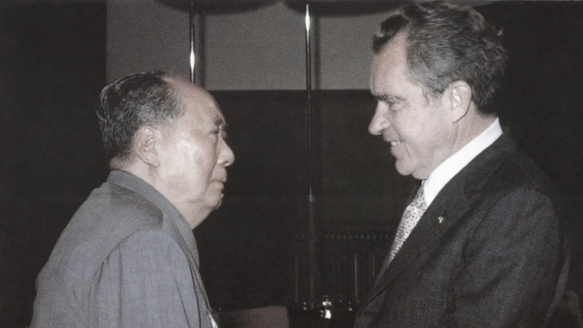 Chinese communist leader Chairman Mao Zedong (L) welcomes U.S. President Richard Nixon, at his house in Beijing on Feb. 21, 1972. (AFP via Getty Images)