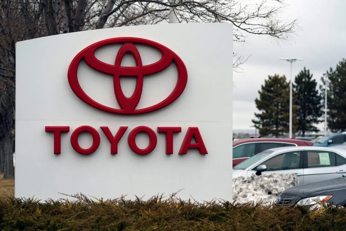 The company logo adorns a sign outside a Toyota dealership in Lakewood, Colo., on March 21, 2021. (David Zalubowski/AP Photo)