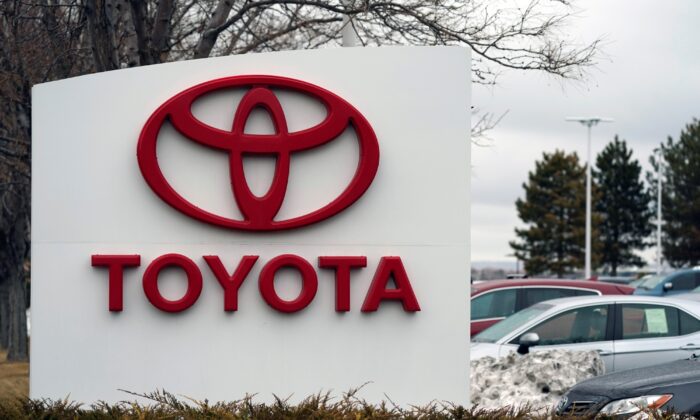 The company logo adorns a sign outside a Toyota dealership in Lakewood, Colo., on March 21, 2021. (David Zalubowski/AP Photo)